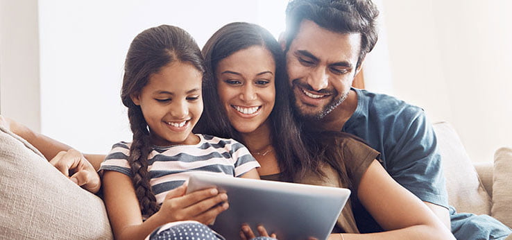 Mobile-FamilyCouch Vexus Fiber customers enjoying the speed and reliability that comes with Vexus Fiber Optic Internet Service while using their tablet